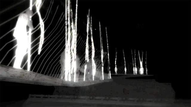 0_abyssalSomewhere screenshot: glowing white figures stand along a dark bridge strung with lines of light