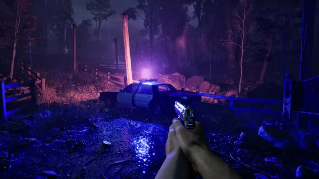 A.I.L.A screenshot: a pistol aimed at an abandoned police car with its lights flashing in a rainy forest