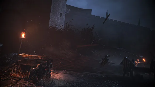 A wave of rats pouring over soldiers at night below a castle wall, Amicia hiding behind cover by a torch