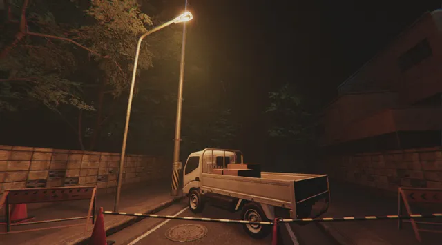 A road closed with cones and barrier tape beside a parked kei truck under a street lamp