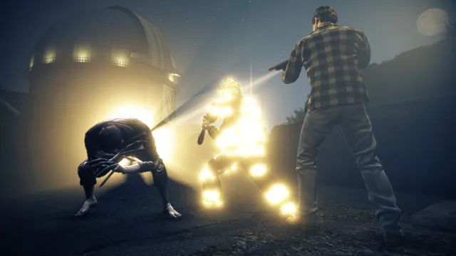 Alan shines his flashlight at giant spiders crawling across a dark desert road by a railway crossing