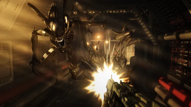 Aliens vs. Predator screenshot: a Xenomorph lunges from a metal corridor as a Marine fires his rifle