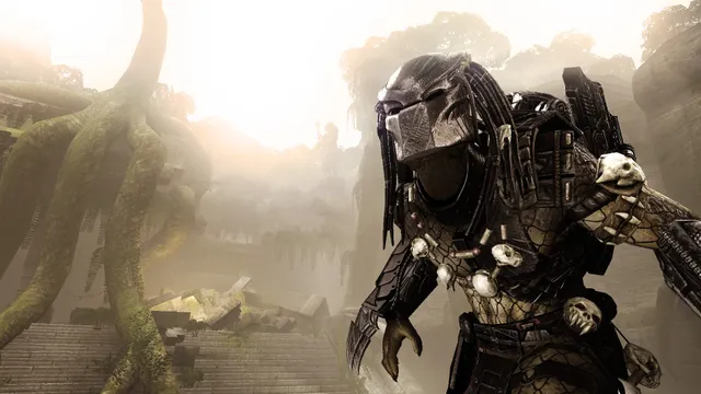 Aliens vs. Predator screenshot: a Predator with a mask and shoulder cannon in misty jungle ruins