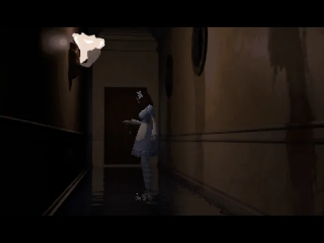 Alisa walks down a dark, narrow mansion corridor lit by a single wall lamp, seen from a fixed camera