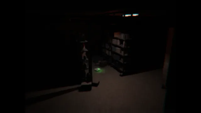 Alone. Again. screenshot: a dim basement with shelves and clutter, a small green light on the floor