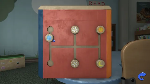 A puzzle box with sun, moon and flower symbols on a sliding track in the children's corner