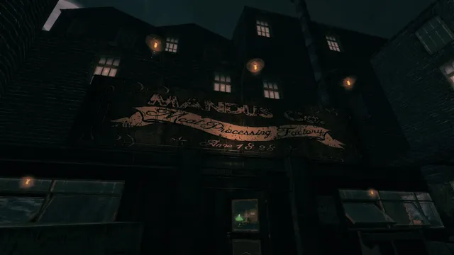 Amnesia: A Machine for Pigs screenshot: the brick facade of the Mandus Co. Meat Processing Factory at night, lit by a few windows and lamps