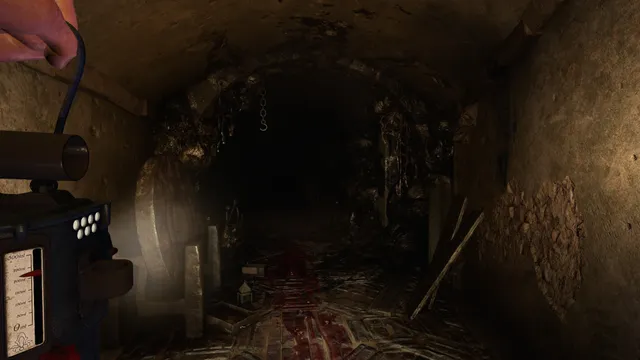 Amnesia: Rebirth screenshot: Tasi holds up a lantern in a blood-smeared tunnel