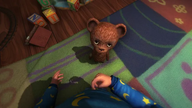 Among the Sleep screenshot: looking down at your small hands on a play mat as the brown teddy bear looks up at you
