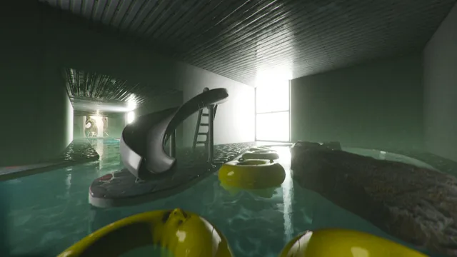 Anemoiapolis screenshot: an empty indoor pool with a dark slide, yellow floating rings and light from a tall window