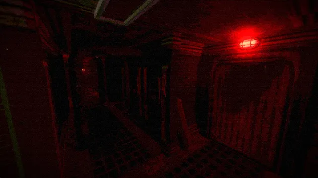A dark corridor lit by a single red emergency light