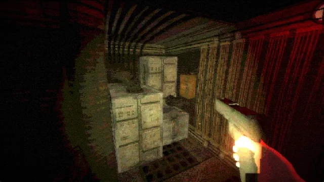 A red-lit storage room with stacked crates and a hand holding a glowing tool