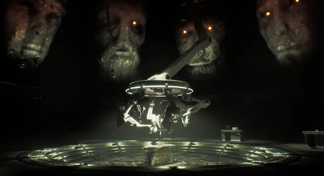 A mechanical arm over a stone on a lit platform, with huge carved stone faces with glowing eyes in the dark behind