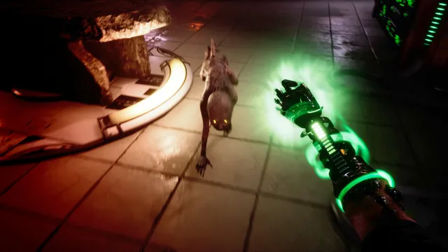 A thin grey creature with glowing yellow eyes crawls across a tiled floor toward the player's glowing green mechanical arm