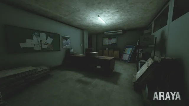 ARAYA: a cluttered office with a notice board and a single fluorescent tube