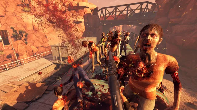 Arizona Sunshine Remake screenshot: a crowd of bloodied zombies rushes at the player's shotgun on a canyon walkway
