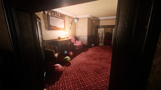 A doorway onto a hotel lounge with red patterned carpet and party balloons lying on the floor