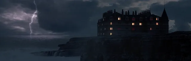 At Dead Of Night art: a lit-up Victorian hotel on a clifftop above the sea at night, with lightning in the storm clouds