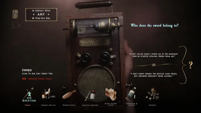 The ghost voice receiver in contact with Amy, a 10-year-old girl, being asked who a sword belongs to, with found items along the bottom