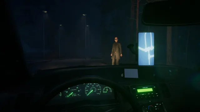 Backseat screenshot: from the taxi's driver seat at night, a man in sunglasses and a long coat waits by the road among dark trees