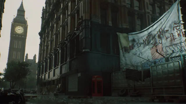 A barricaded street in Westminster under Big Ben with a hand-painted banner over the fence