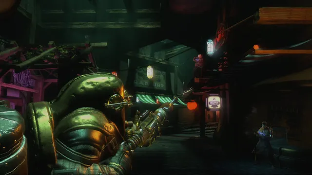 BioShock 2 screenshot: a Big Daddy aims a rivet gun down a neon-lit street of ruined shops in Rapture