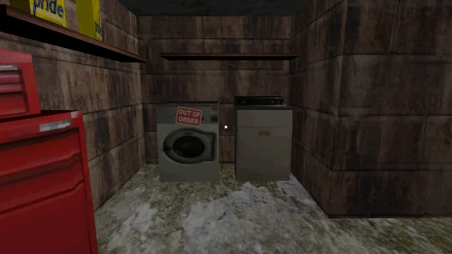 A dirty basement with an out-of-order washing machine and a red tool chest