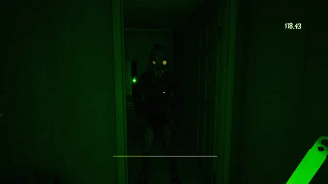 A green-lit monster standing in a doorway as the player holds up a glow stick
