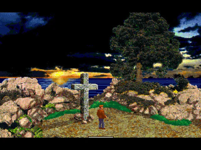 Shadow of the Comet screenshot: Parker stands by a stone cross on a rocky clifftop above the sea at dusk