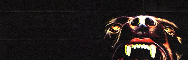 CANINE art: a snarling dog's face with bared fangs and glowing eyes against black
