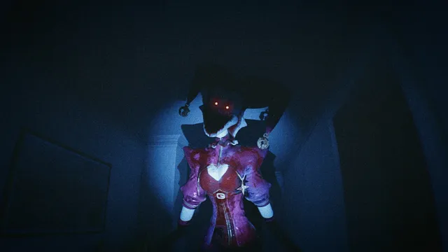 A jester doll with glowing red eyes in a pink costume stands in a dark corridor under a flashlight beam