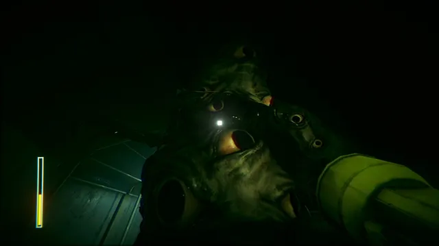 A mass of pale faces with staring eyes looming in the dark close to the player