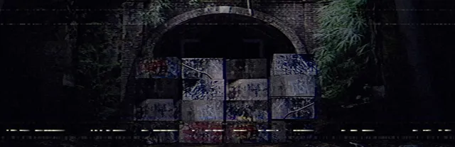 Inunaki Tunnel key art: the arched tunnel mouth blocked with graffiti-covered concrete blocks, seen through VHS noise