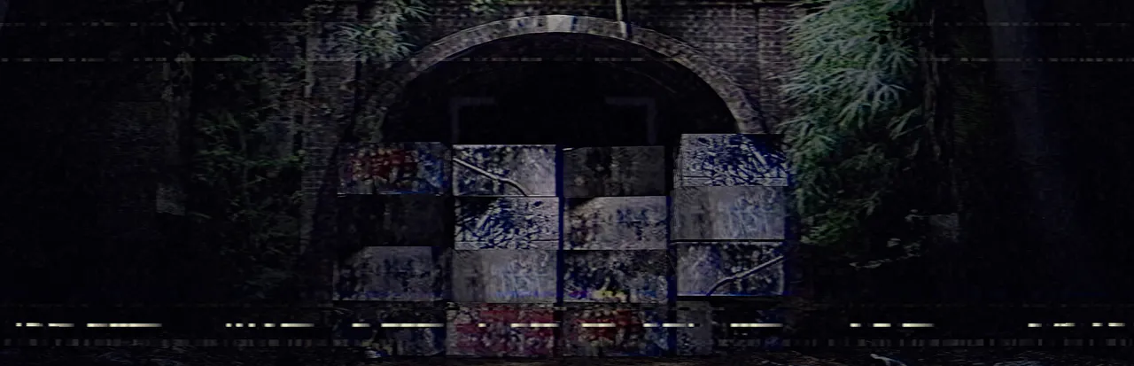Inunaki Tunnel key art: the arched tunnel mouth blocked with graffiti-covered concrete blocks, seen through VHS noise