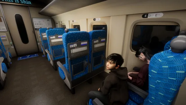 A boy in a hoodie sits in a blue bullet-train seat beside a woman slumped with her face hidden
