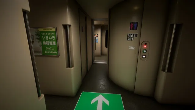 The vestibule between train cars, with a green arrow on the floor pointing ahead and toilet signs on the wall