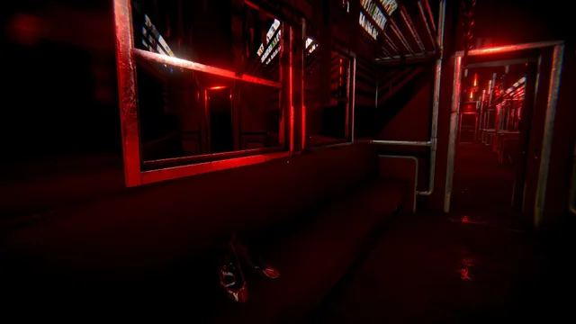 A train carriage lit blood red, a pair of shoes left on the floor below the seat