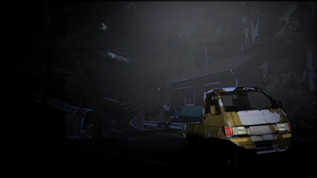 A battered yellow mini truck parked by a dark wooden building among trees at night