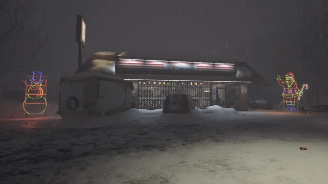 A lit roadside shop in falling snow, with light-up snowman and Santa figures outside