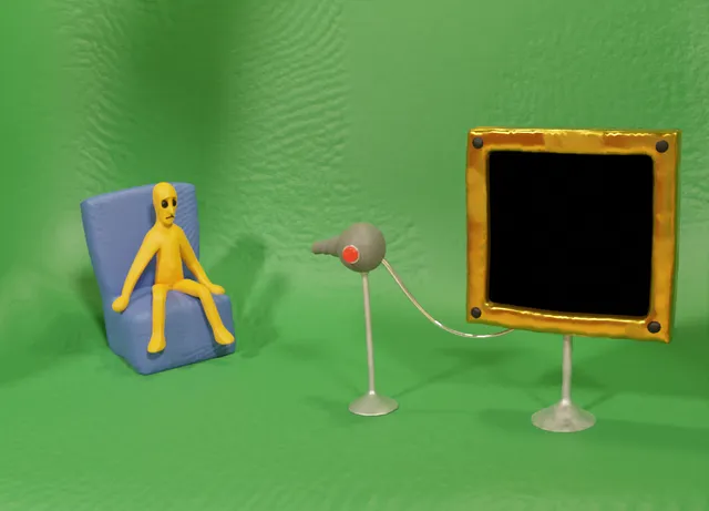 Clay-Scape! screenshot: a yellow clay man sits in a blue armchair against a green wall, facing a gold-framed black screen and a hair dryer on a stand