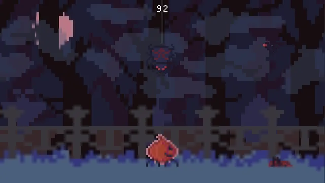 The pumpkin crawls along the cemetery path while a red-eyed spider hangs above on a thread
