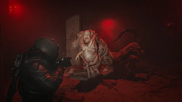 Cronos: The New Dawn screenshot: the Traveler aims at a bloated, fleshy creature in a room lit red