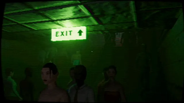 A crowd of people under a green exit sign in a dark underground passage