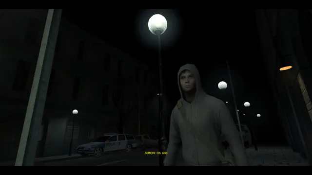 Cry of Fear screenshot: a young man in a white hoodie stands under a street lamp on a dark town street with a police car behind him