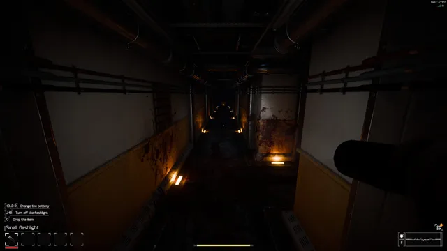 CRYO screenshot: a long dark corridor with blood on the walls and small lights on the floor