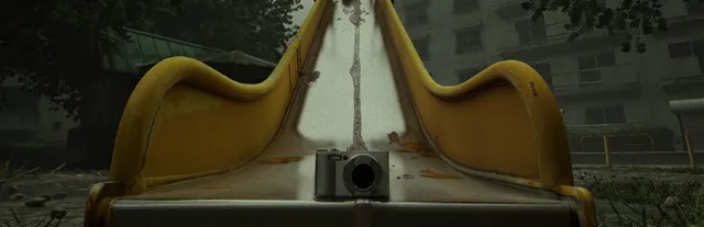 Cursed Digicam key art: a compact digital camera at the foot of a yellow playground slide in front of grey apartment blocks