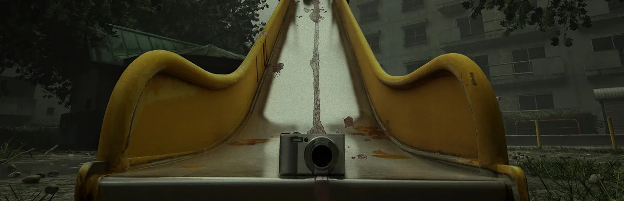 Cursed Digicam key art: a compact digital camera at the foot of a yellow playground slide in front of grey apartment blocks