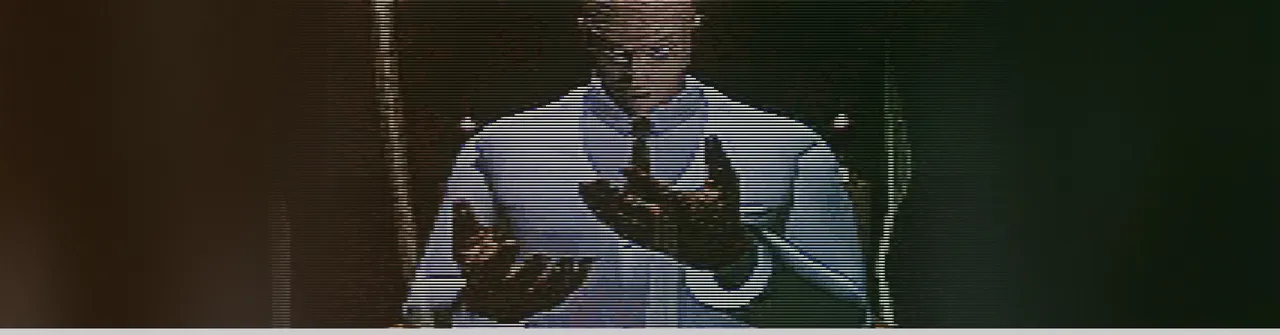 D: The Game art: Dr Richter Harris in a shirt and tie holds up his bloodied hands, in a scan-lined frame from the game
