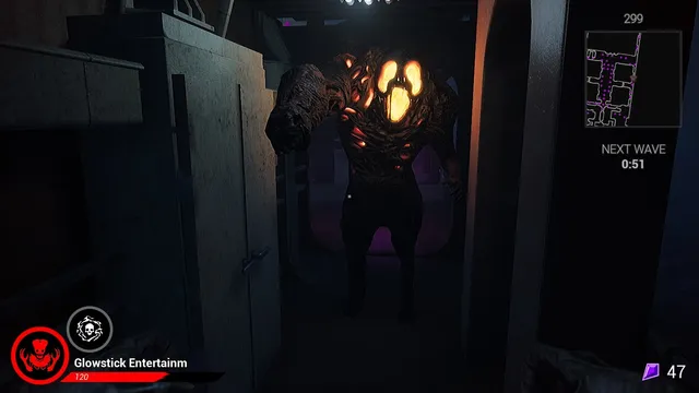 A hulking monster with a glowing face stepping through a dark doorway