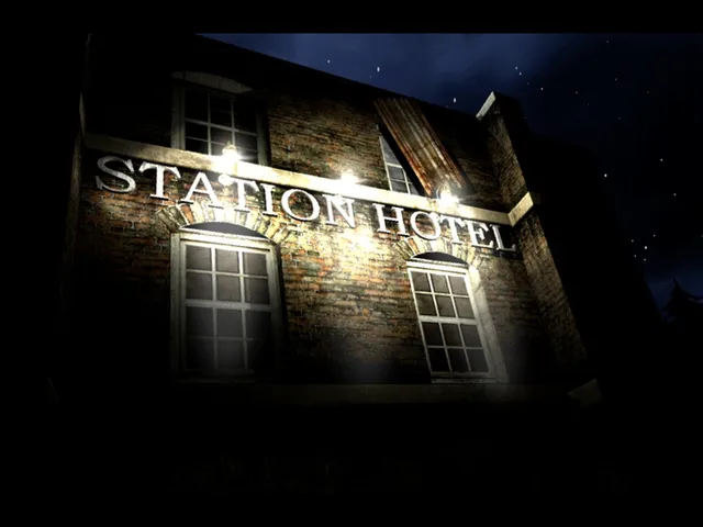 Dark Fall: Lost Souls screenshot: the brick front of the Station Hotel lit by lamps under a night sky